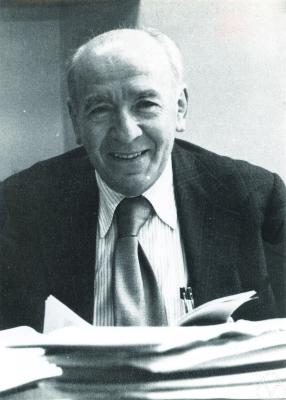 Photograph of Mark Kac at a desk